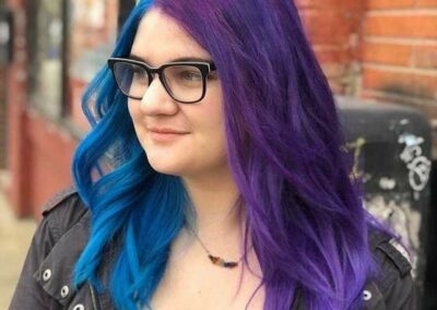 Person with blue hair on the left, and purple hair on the right.